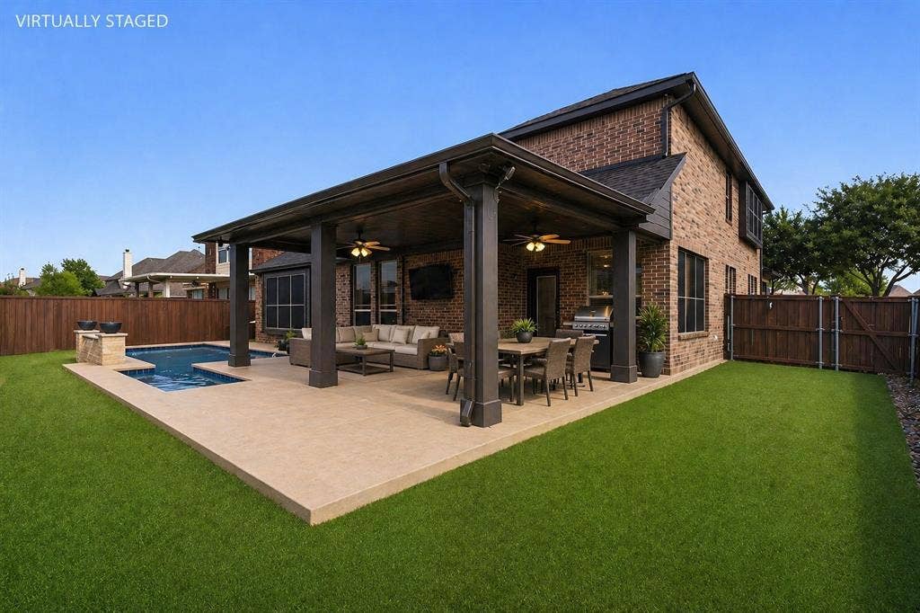 2760 Explorador, Grand Prairie, TX 75054 Brick exterior with a covered patio, featuring a swimming pool, artificial turf and expansive decking
