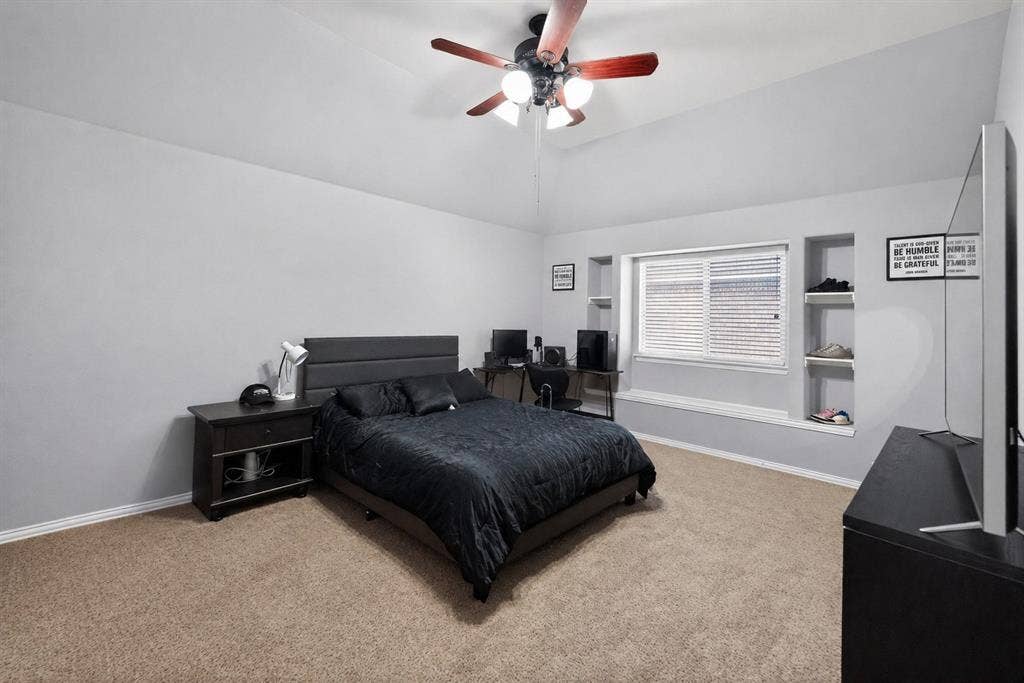 2760 Explorador, Grand Prairie, TX 75054 Upstairs - Bedroom # 4 featuring vaulted ceilings enhance this carpeted room featuring a ceiling fan with light fixture
