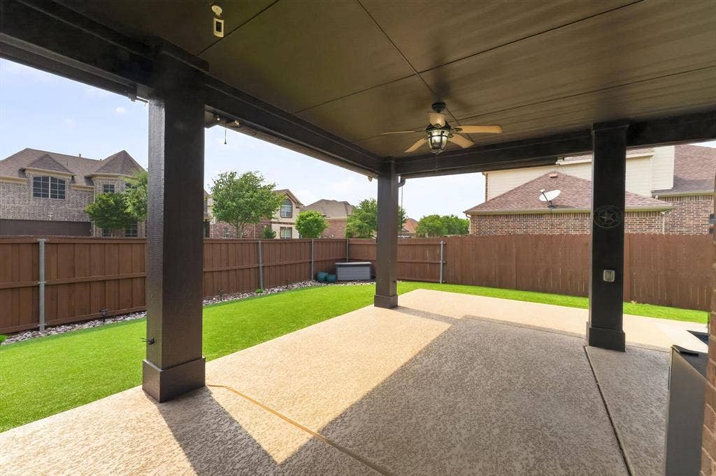2760 Explorador, Grand Prairie, TX 75054 Expansive covered patio featuring a ceiling fan, exposed aggregate concrete flooring, and a flat panel ceiling