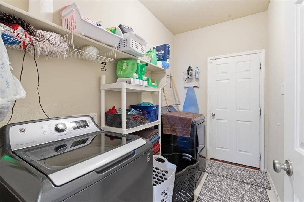 1081 Barrington Drive, Prosper, TX 75078 Dedicated laundry space featuring neutral wall tones