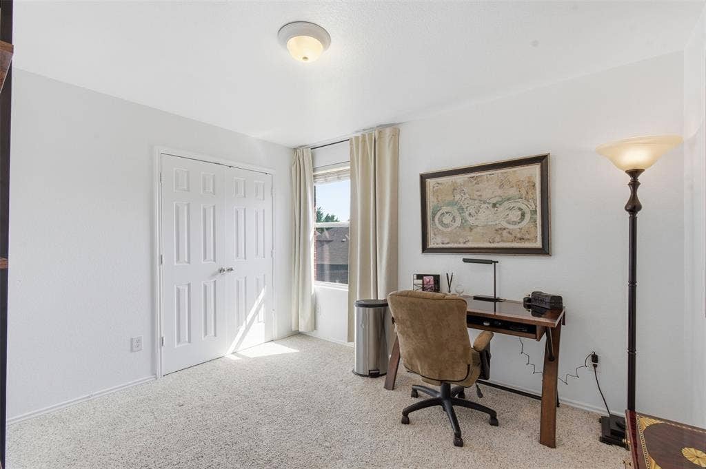 1081 Barrington Drive, Prosper, TX 75078 Carpeted room featuring a double-door closet, a single window with curtain, and a flush-mount ceiling light fixture