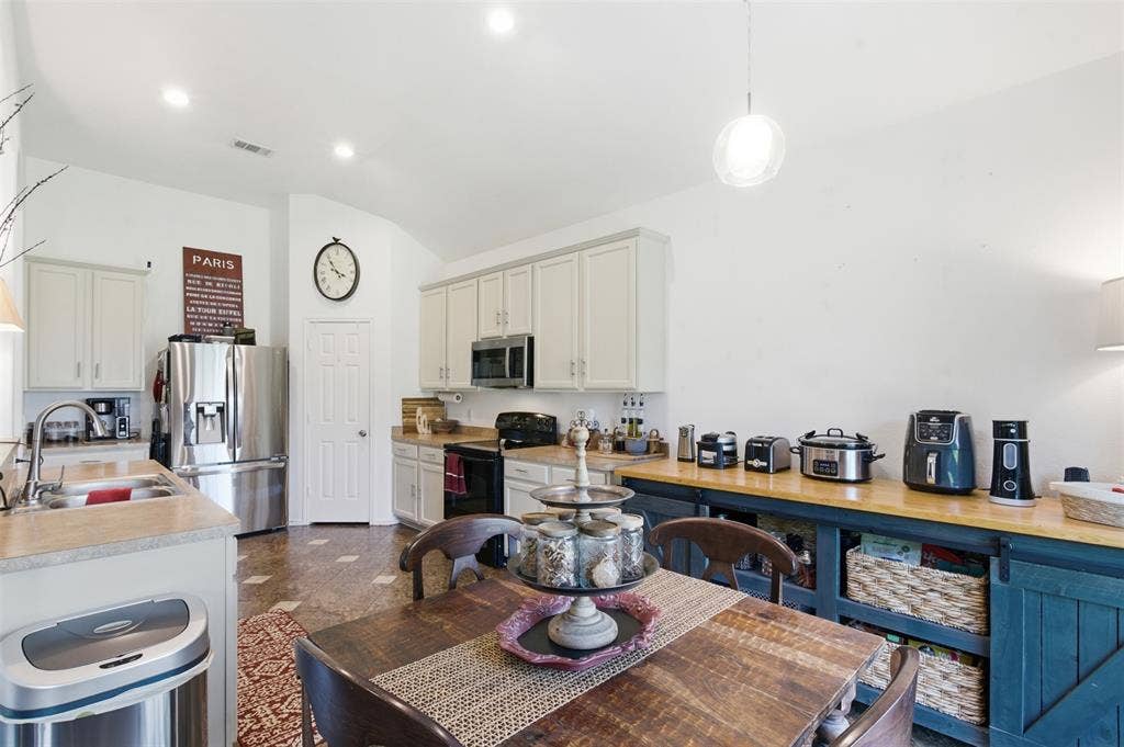 1081 Barrington Drive, Prosper, TX 75078 Open-concept kitchen featuring light-colored cabinetry and stainless steel appliances