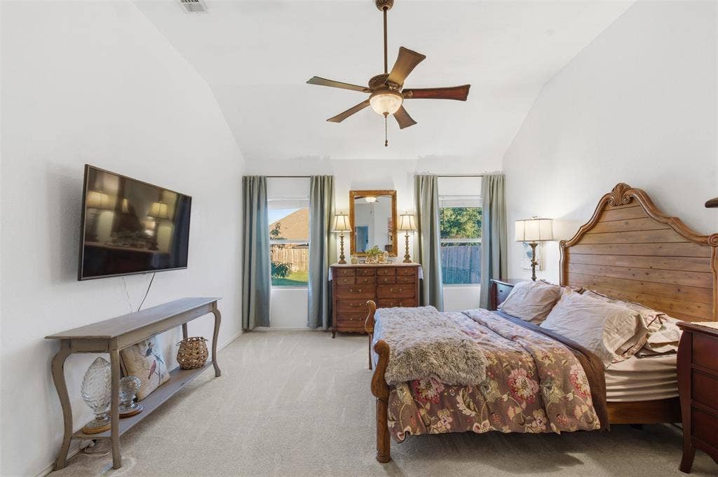 1081 Barrington Drive, Prosper, TX 75078 Spacious bedroom featuring vaulted ceilings and neutral carpeting