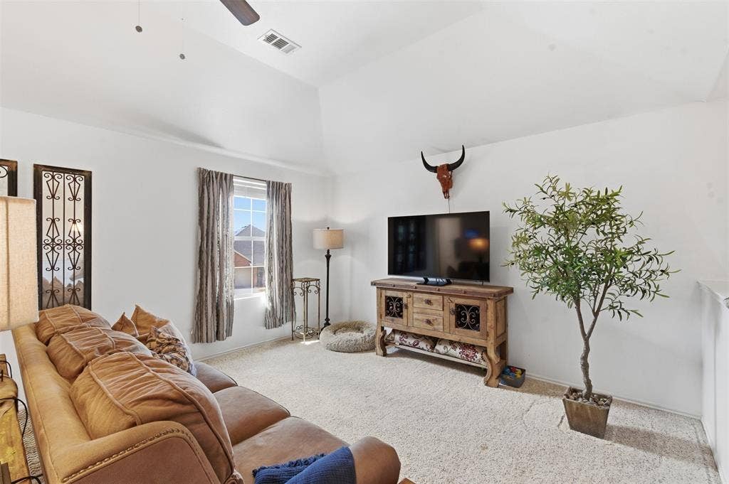 1081 Barrington Drive, Prosper, TX 75078 Bright interior featuring vaulted ceilings and a ceiling fan