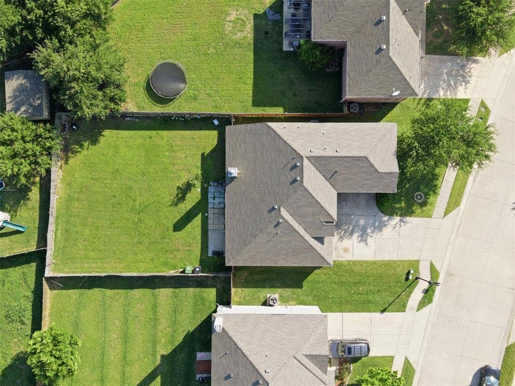 1081 Barrington Drive, Prosper, TX 75078 Aerial view showcasing a residential property with a multi-gabled roofline and an attached garage