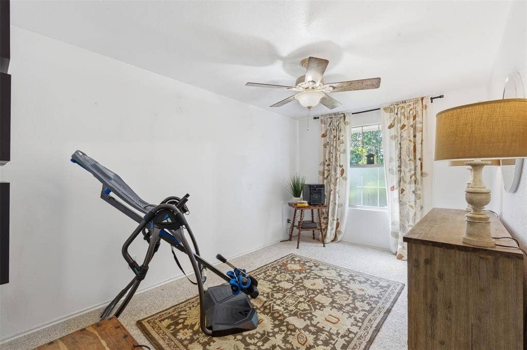 1081 Barrington Drive, Prosper, TX 75078 Room featuring a ceiling fan with light fixture, window with patterned curtains, and neutral wall tones