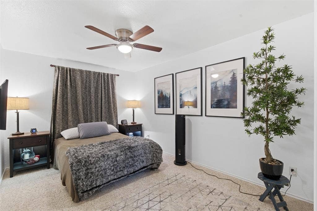 1081 Barrington Drive, Prosper, TX 75078 Carpeted room featuring a ceiling fan with integrated lighting, a full-height window treatment, and three wall-mounted framed art pieces