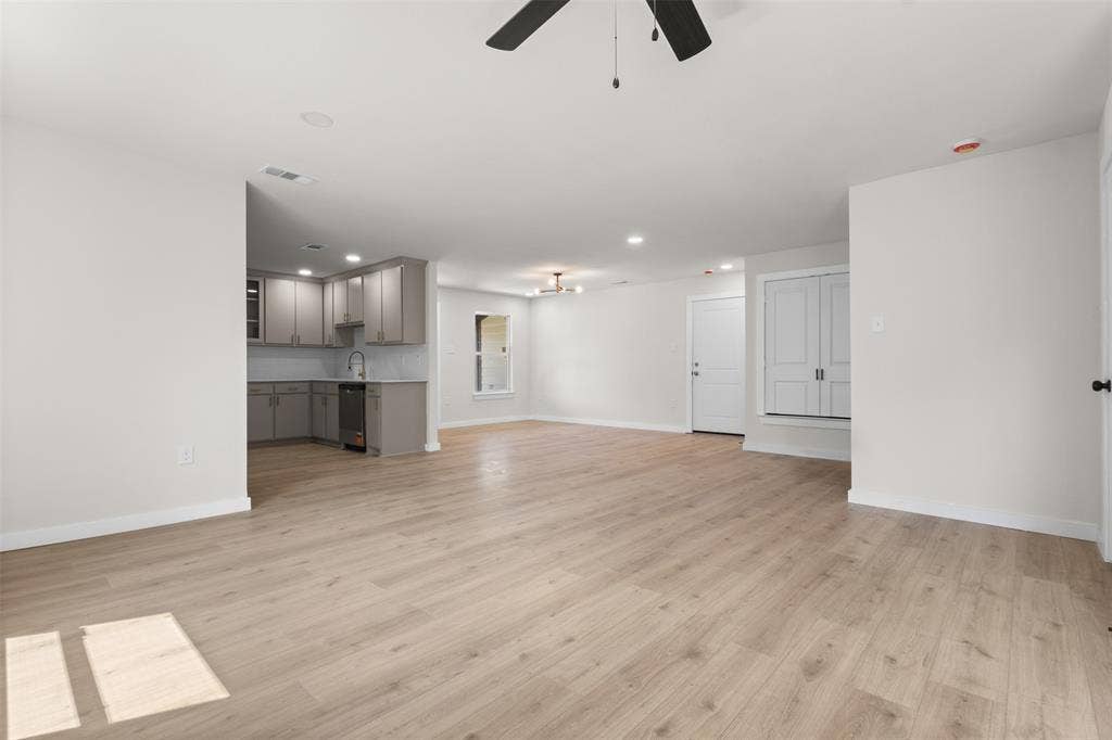 314 NW 15th Street, Grand Prairie, TX 75050 Open-concept living space with wood-finish flooring, recessed lighting, and a ceiling fan
