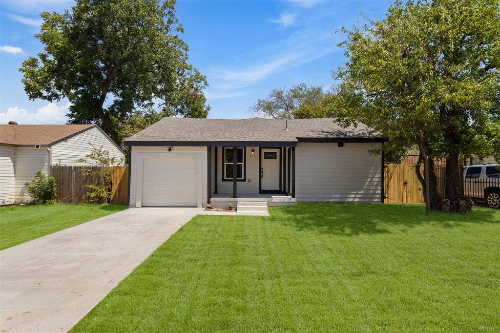 314 NW 15th Street, Grand Prairie, TX 75050 Single-story residence featuring a front-facing garage, covered entryway, and a concrete driveway