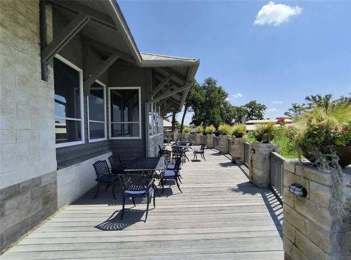 203 Saint Andrews Drive, Mabank, TX 75156 Expansive exterior decking constructed from wood planks