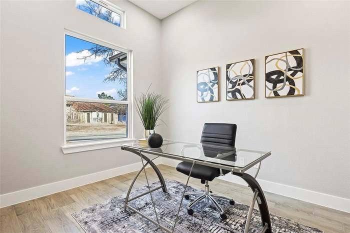 203 Saint Andrews Drive, Mabank, TX 75156 Room featuring wood-finish flooring, a tall window, and a transom window