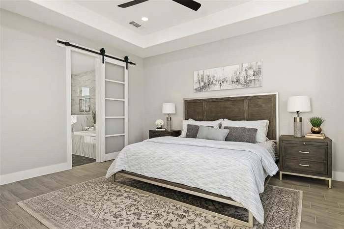 203 Saint Andrews Drive, Mabank, TX 75156 Tray ceiling with a ceiling fan