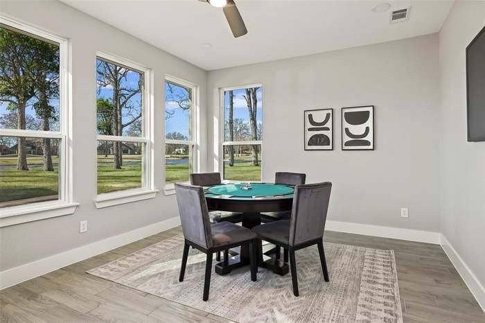 203 Saint Andrews Drive, Mabank, TX 75156 Room featuring wood-finish flooring, light grey walls, and white baseboards