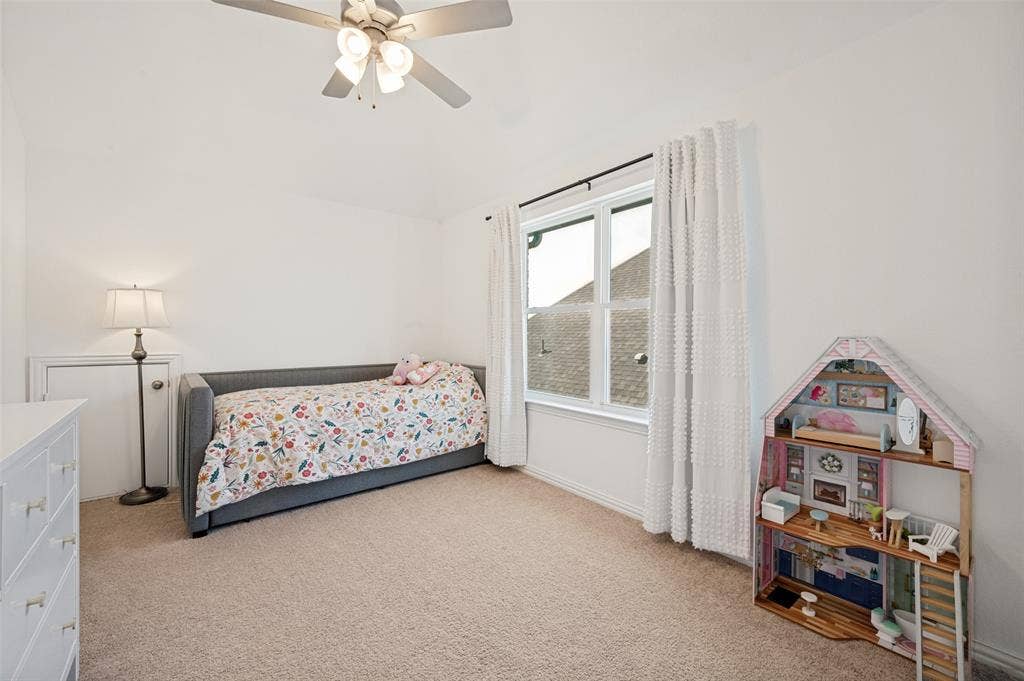 961 Gladewater Drive, Prosper, TX 75078 Second floor bedroom exudes natural lighting and has arched heightened ceilings for added charm and space