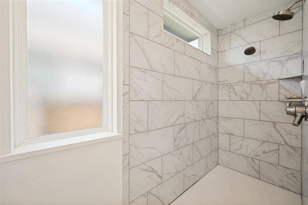 961 Gladewater Drive, Prosper, TX 75078 Tiled large walk in shower with dual shower heads are a bonus for this secondary bathroom