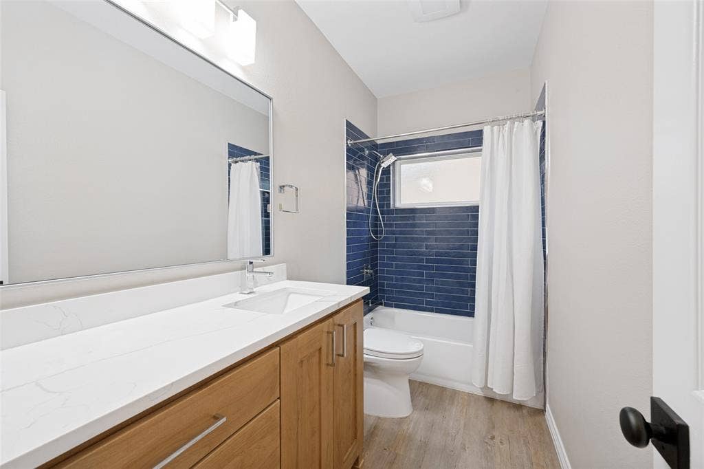 1818 Haydenbend Circle, Grapevine, TX 76051 Bathroom with tiled shower and wood like floor