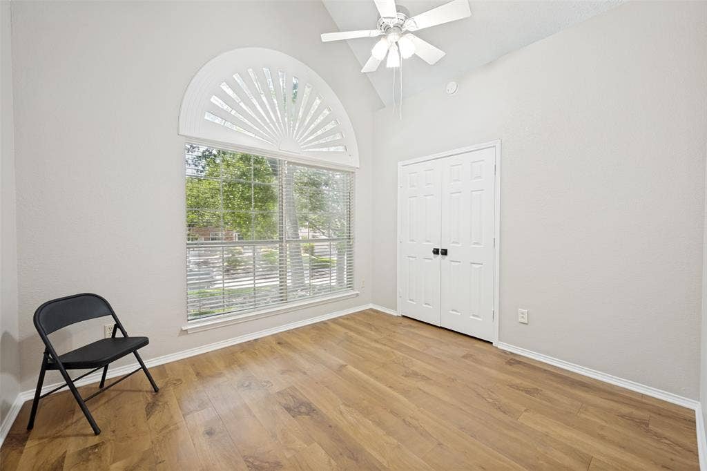 1818 Haydenbend Circle, Grapevine, TX 76051 Bedroom with wood like floors and large bay window