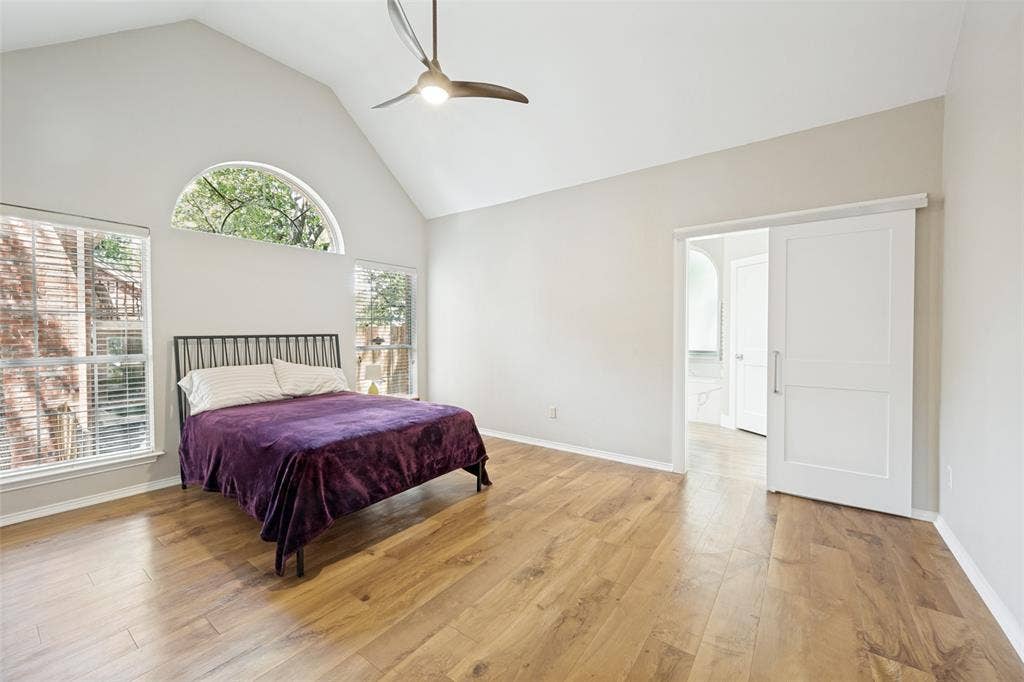 1818 Haydenbend Circle, Grapevine, TX 76051 Primary bedroom with wood like floors and large windows
