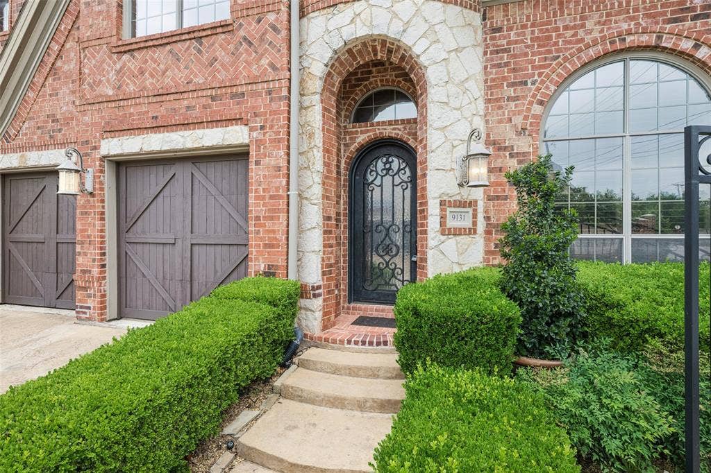 9131 Cochran Bluff Lane, Dallas, TX 75220 Brick and stone exterior.