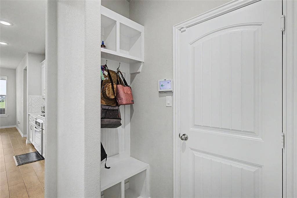 185 Chester Road, Springtown, TX 76082 Built-in mudroom bench with cubbies, upper shelving, and coat hooks
