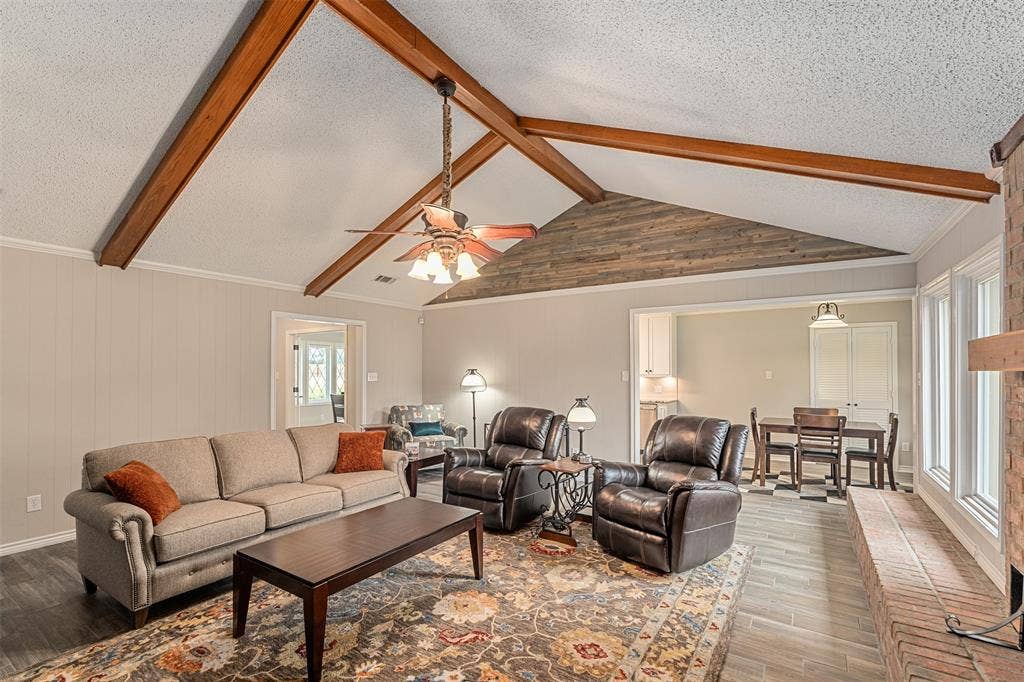 1102 Mill Run Road, Athens, TX 75751 Living with brick fireplace, vaulted ceilings and beautiful wood beams