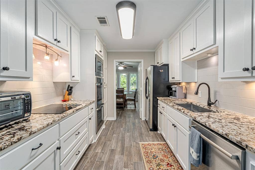 1102 Mill Run Road, Athens, TX 75751 kitchen with double ovens and built in microwave.
