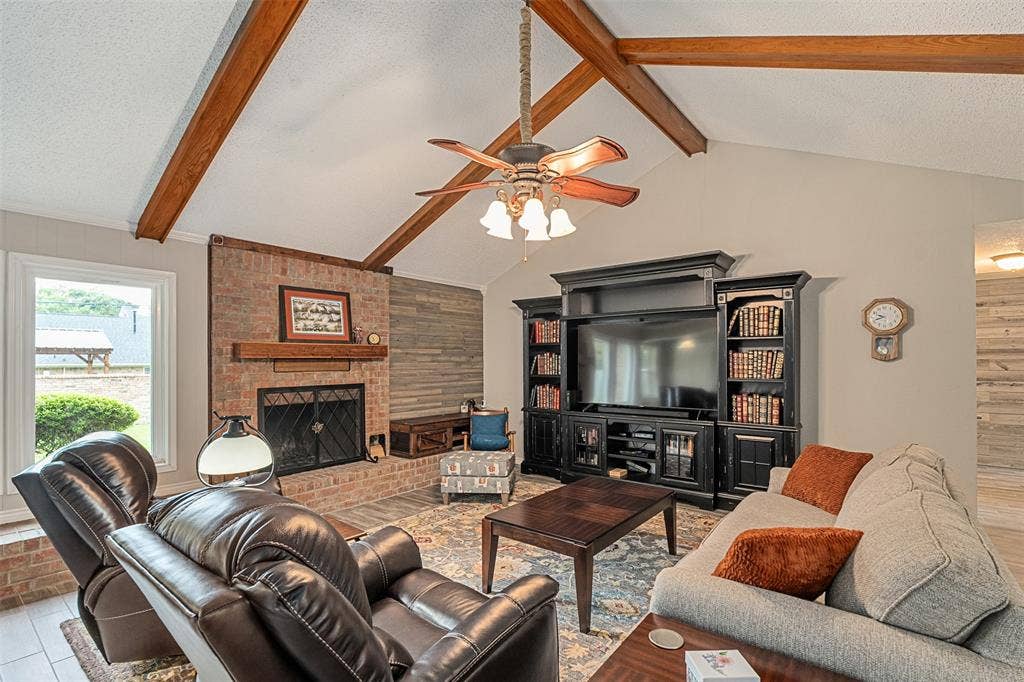 1102 Mill Run Road, Athens, TX 75751 Living with brick fireplace, vaulted ceilings and beautiful wood beams