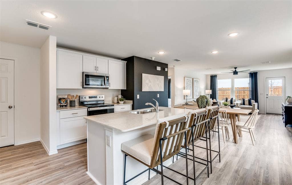 816 Springwell Drive, Princeton, TX 75407 *Model Representation - Large island overlooking gathering room and dining areas