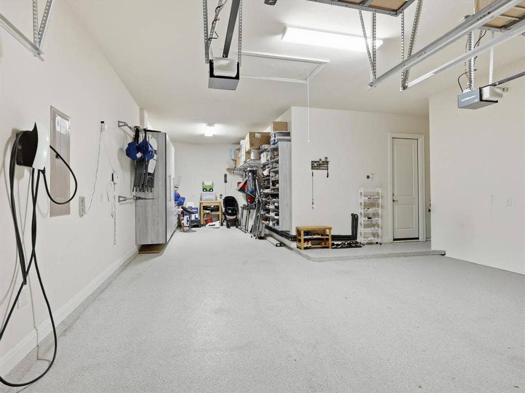 2724 Dames Lane, Irving, TX 75063 3 Car Garage w/ Custom Shelves & Electric Charging Station
