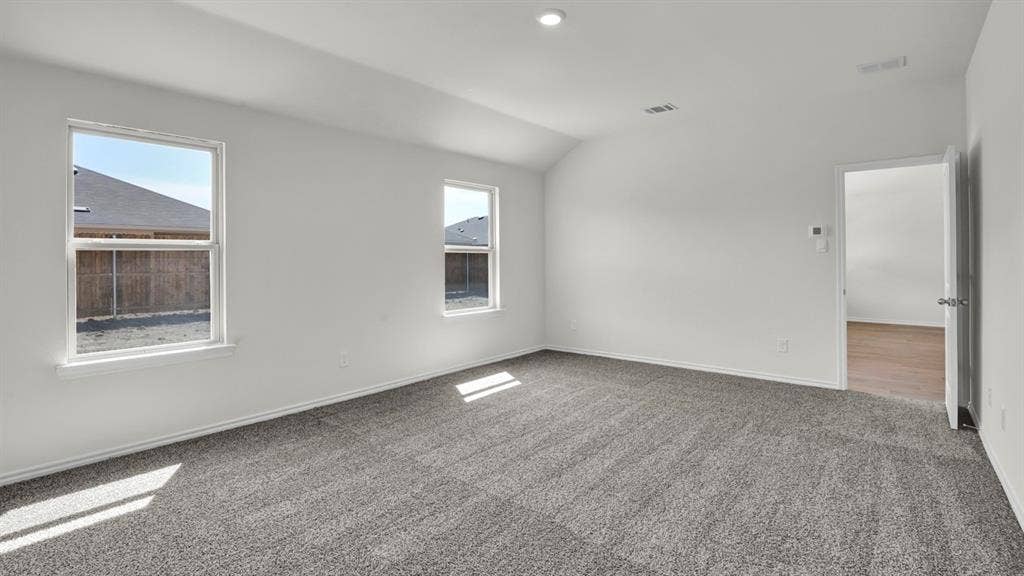 200 Bandit Trail, Terrell, TX 75160 Spacious room featuring gray textured carpet and bright white walls