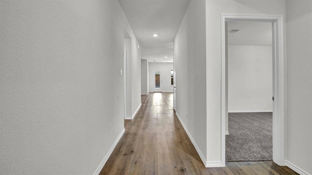 200 Bandit Trail, Terrell, TX 75160 Hallway with wood-finish flooring, recessed lighting, and crisp white trim