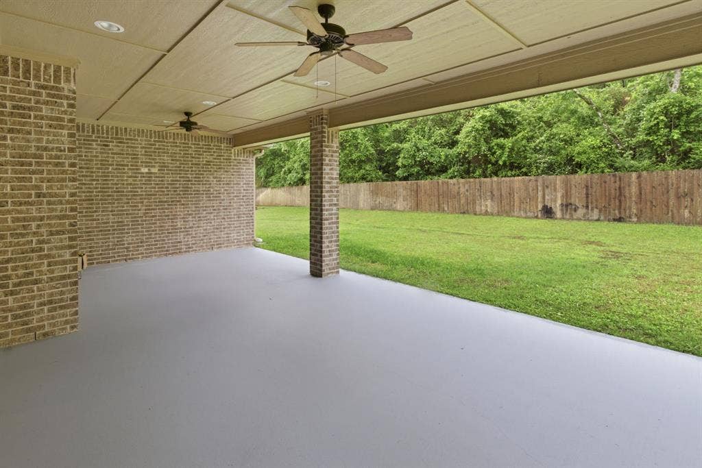7765 Hickory Spring Lane, Tyler, TX 75703 Covered patio featuring a painted concrete floor and brick columns