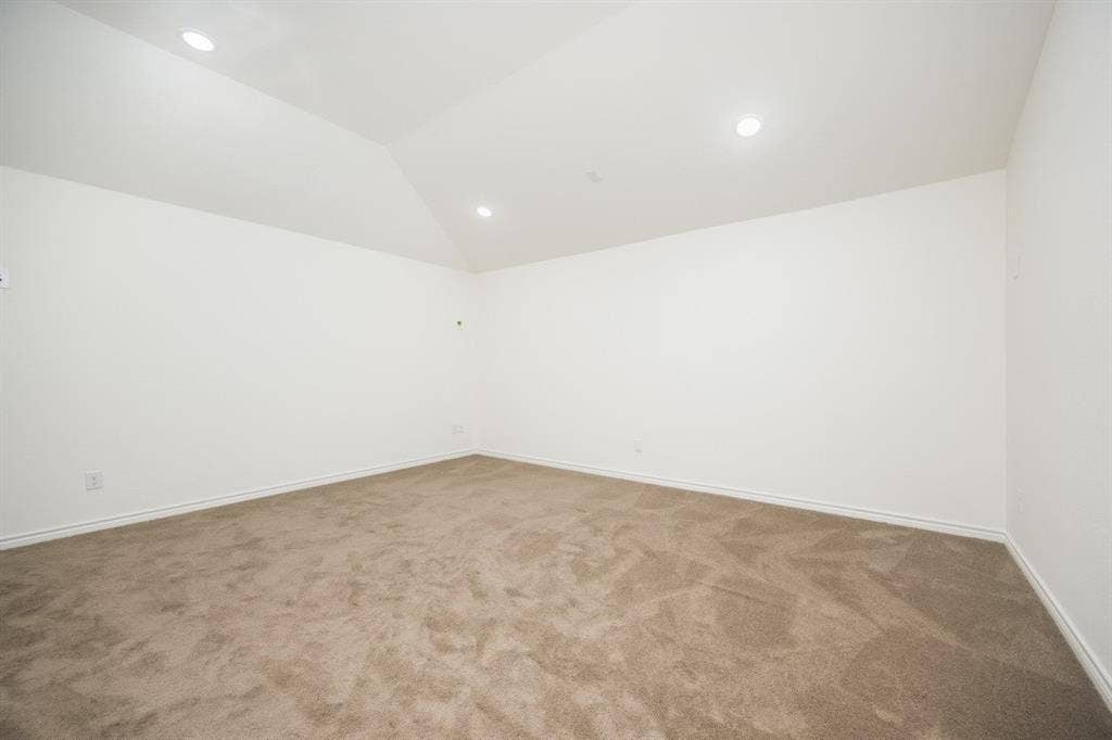 2813 Walker Way, Northlake, TX 76247 Spacious room featuring vaulted ceilings, recessed lighting, neutral wall tones, clean baseboards, and plush carpeting