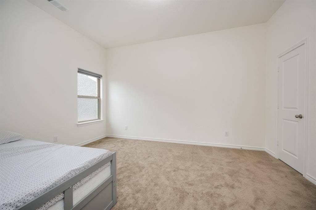2813 Walker Way, Northlake, TX 76247 Bright room with neutral carpeting and light-colored walls