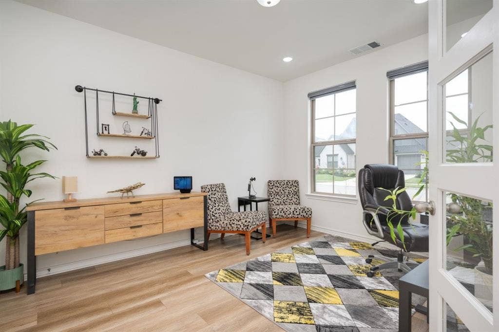 2813 Walker Way, Northlake, TX 76247 Bright room with two large windows, wood-finish flooring, a built-in wall shelf, and recessed lighting