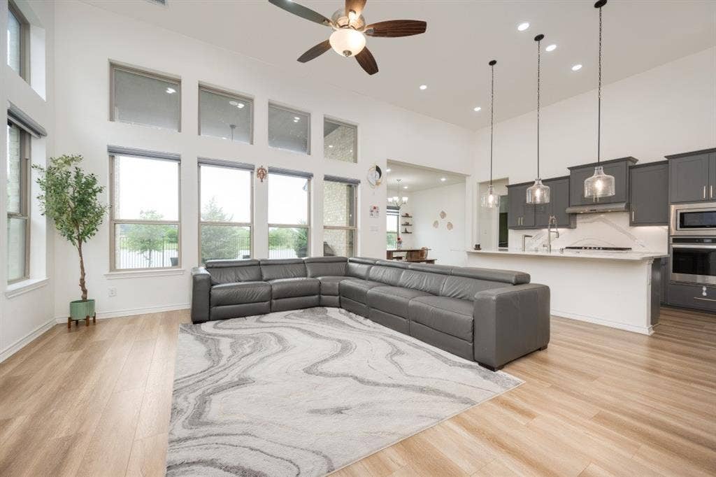 2813 Walker Way, Northlake, TX 76247 Spacious open-concept interior featuring light wood-finish flooring and high ceilings