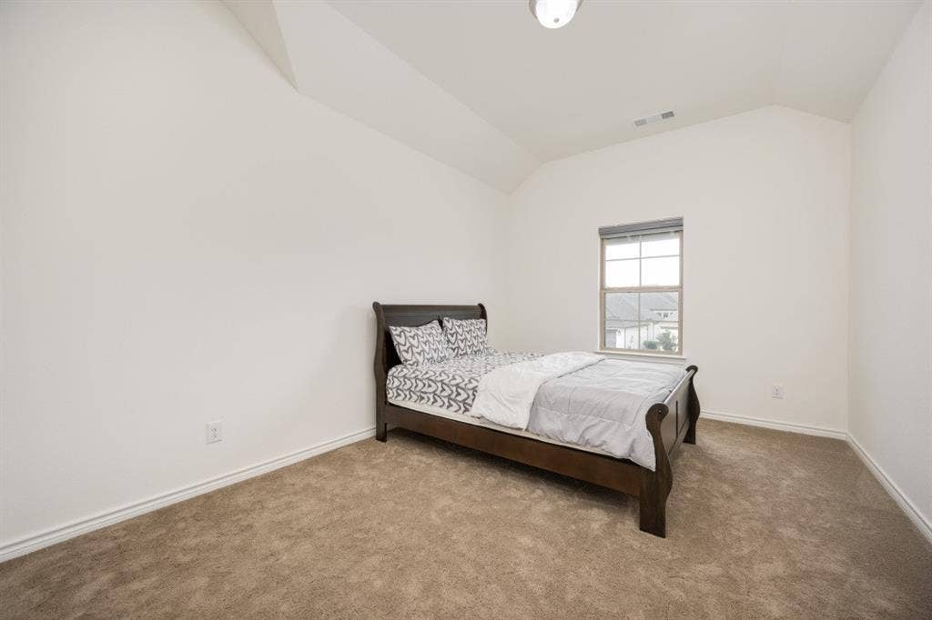 2813 Walker Way, Northlake, TX 76247 Room featuring a single window with blinds, carpeted flooring, and a vaulted ceiling