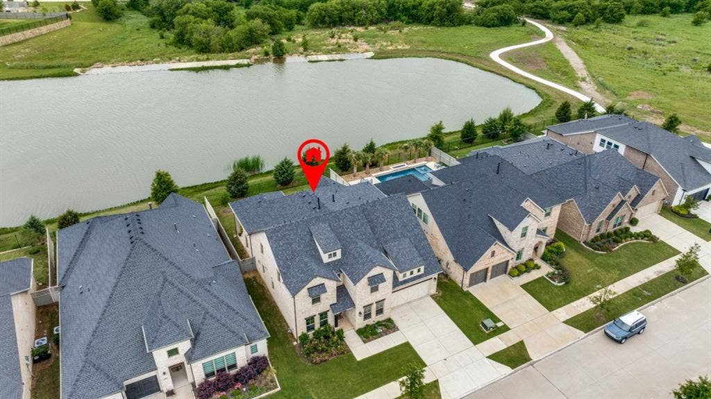 2813 Walker Way, Northlake, TX 76247 Residential property featuring a dark shingle roof, light-colored brick exterior, and an attached two-car garage
