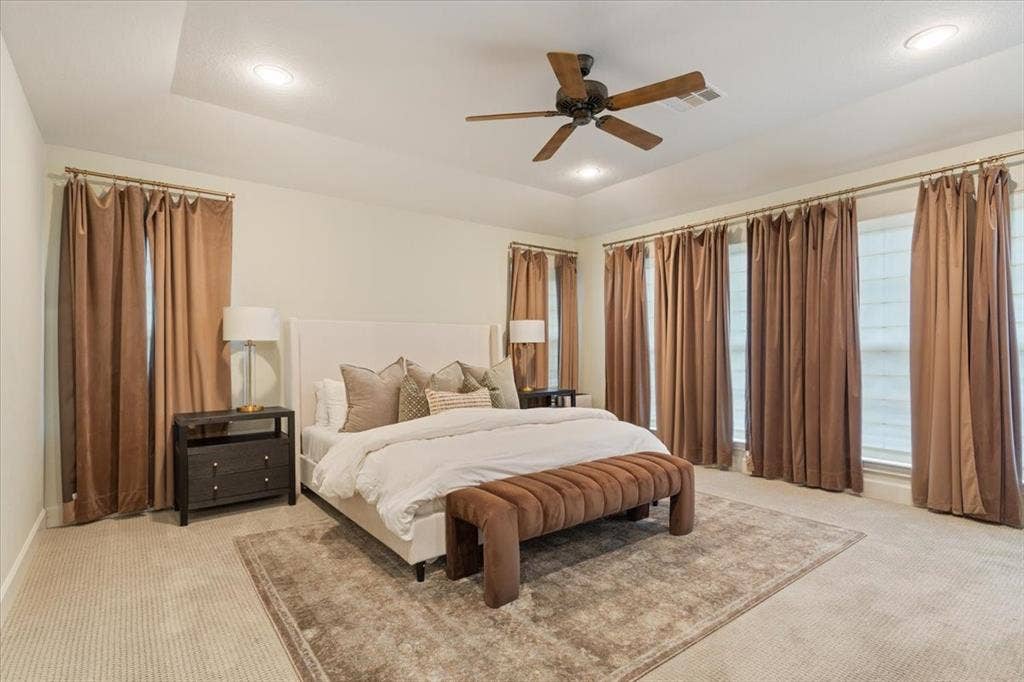 402 Shadow Mountain Drive, Woodway, TX 76712 Spacious upstairs primary suite with tray ceiling, recessed lighting, and a five-blade ceiling fan