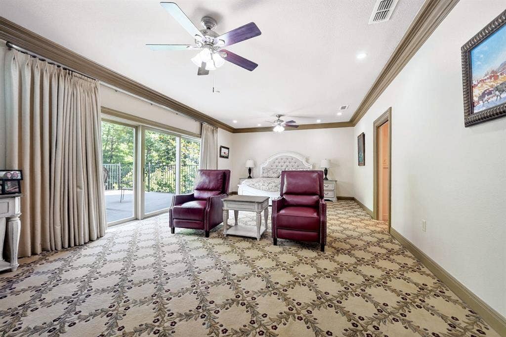 1901 Rose Point, Athens, TX 75752 Spacious room featuring patterned carpeting and crown molding