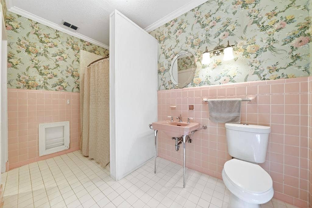 1901 Rose Point, Athens, TX 75752 Bathroom featuring white square floor tiling, pink square wall tiling, and floral wallpaper