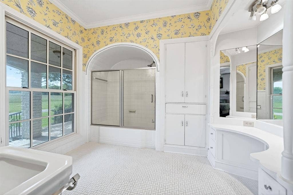 1901 Rose Point, Athens, TX 75752 Bathroom featuring patterned wallpaper and patterned floor tile