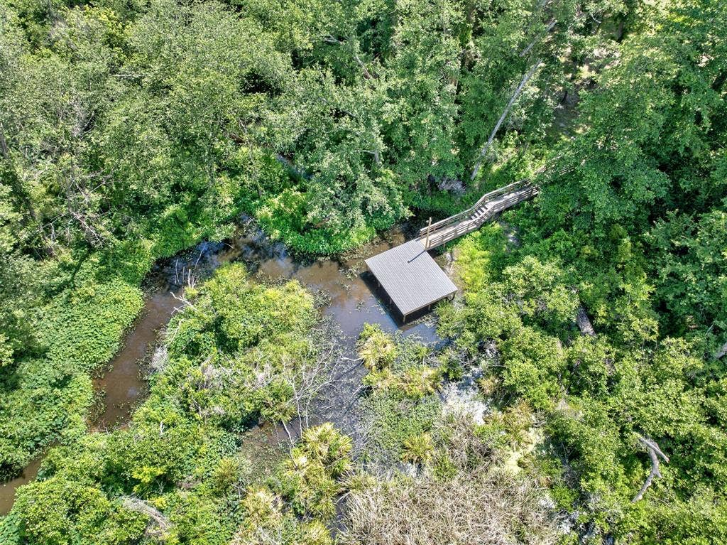 1901 Rose Point, Athens, TX 75752 Dock structure with a covered boat slip, accessed by a wooden walkway