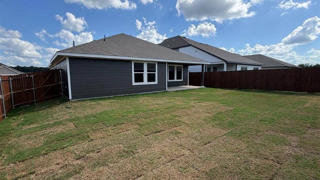 3013 Hidden Valley Drive, Lindale, TX 75771 Expansive backyard featuring a partial sod installation and a full privacy fence