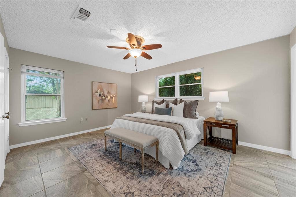 3301 Loma Vista Drive, Waco, TX 76708 Spacious room featuring tile flooring, light neutral wall tones, and a ceiling fan with integrated lighting
