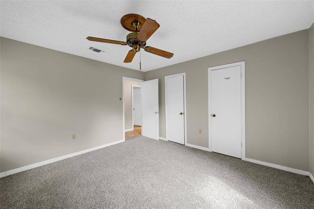 3301 Loma Vista Drive, Waco, TX 76708 Carpeted room with neutral wall paint and white trim