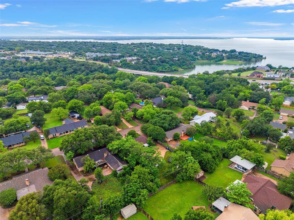 3301 Loma Vista Drive, Waco, TX 76708 Aerial perspective of a residential neighborhood featuring established homes and extensive mature tree coverage