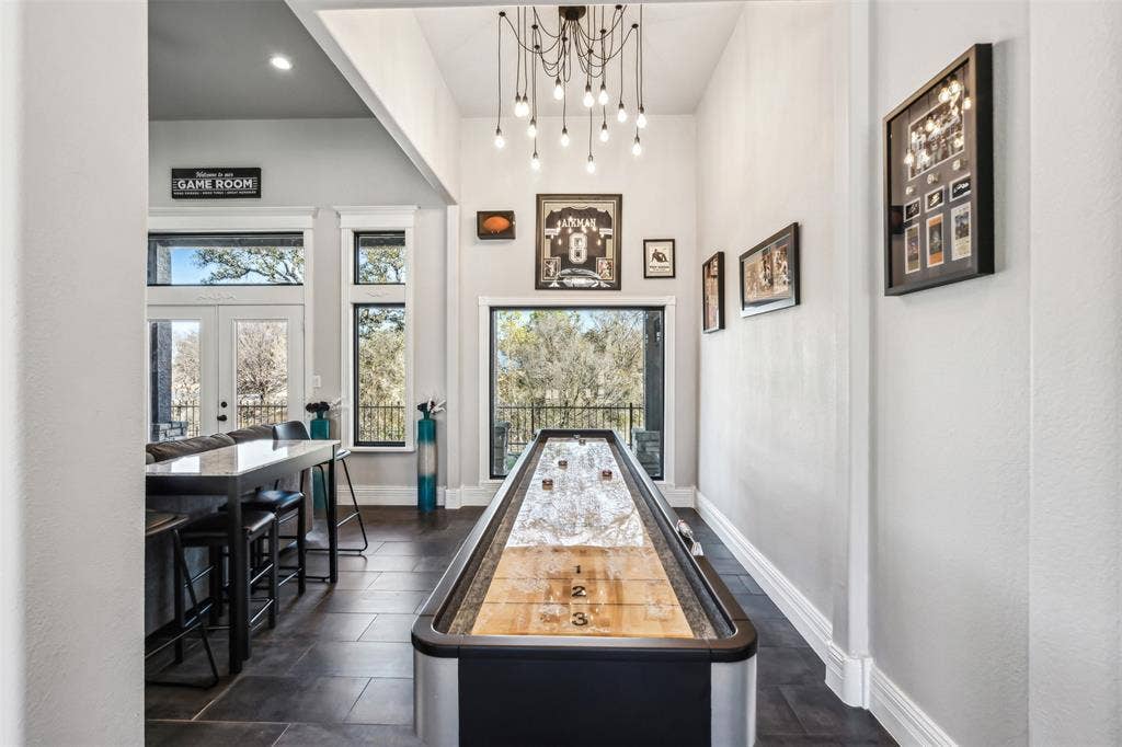2100 Gene Court, Granbury, TX 76048 Vaulted ceiling with a multi-bulb chandelier