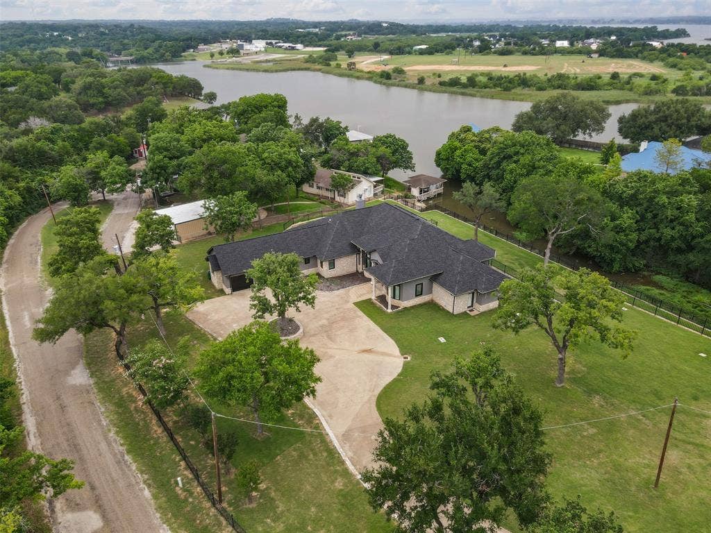 2100 Gene Court, Granbury, TX 76048 Over 1.6 acres on the water in Granbury TX!