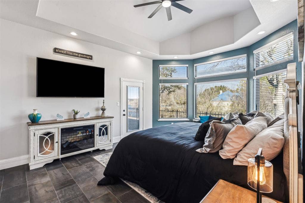 2100 Gene Court, Granbury, TX 76048 Spacious room featuring vaulted ceilings, recessed lighting, and dark tile flooring